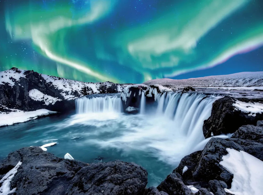 Northern lights over waterfall