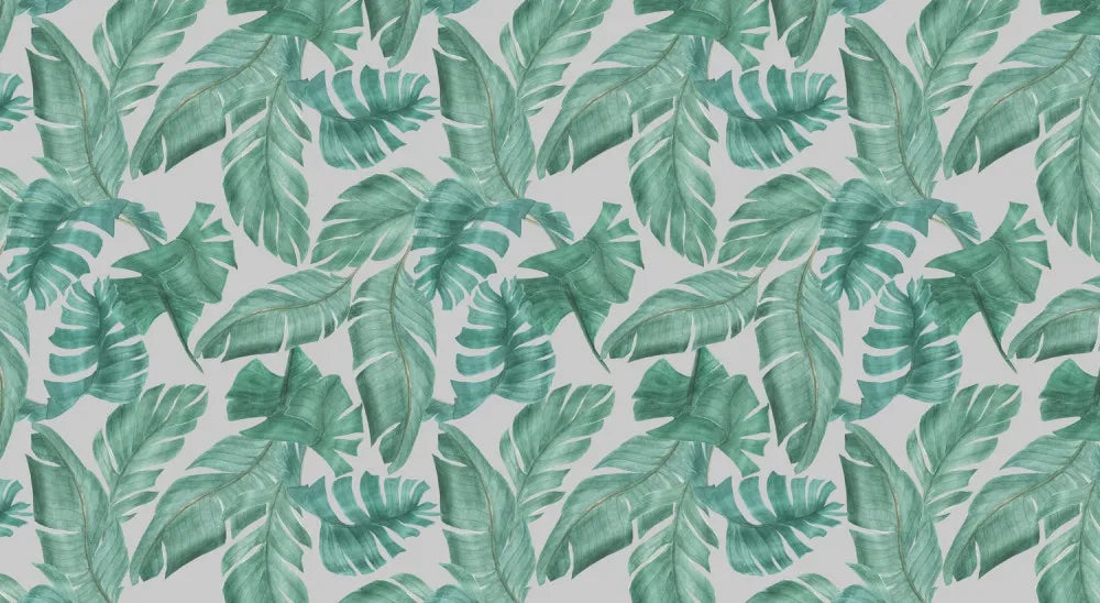 Tropical leaves on gray background