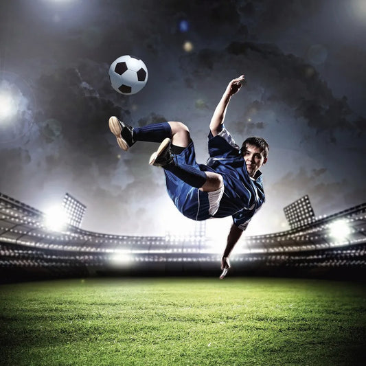 Football player kicks a ball