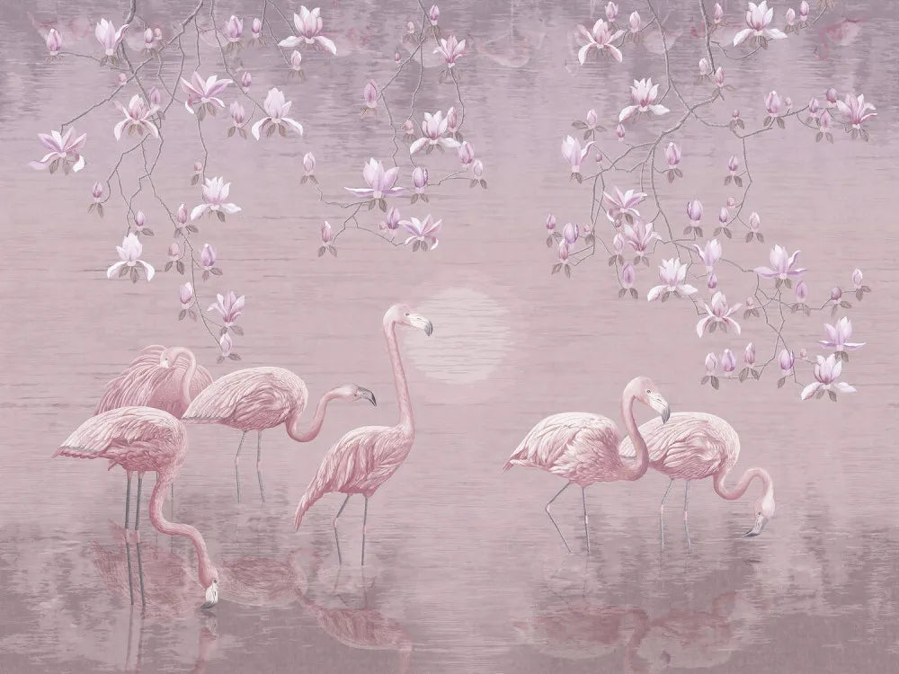 Flamingos on lake at sunset