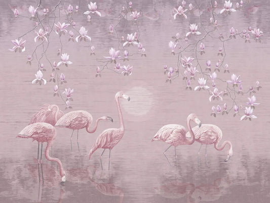 Flamingos on lake at sunset