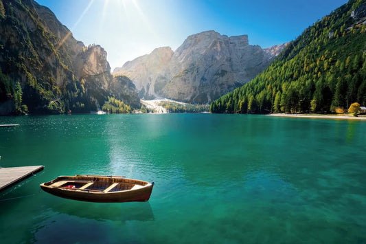 Sun over the mountain lake